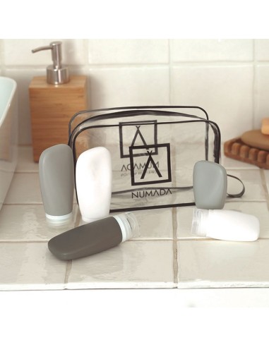 NECESER TRANSPARENTE C/BOTELLAS P/VIAJE